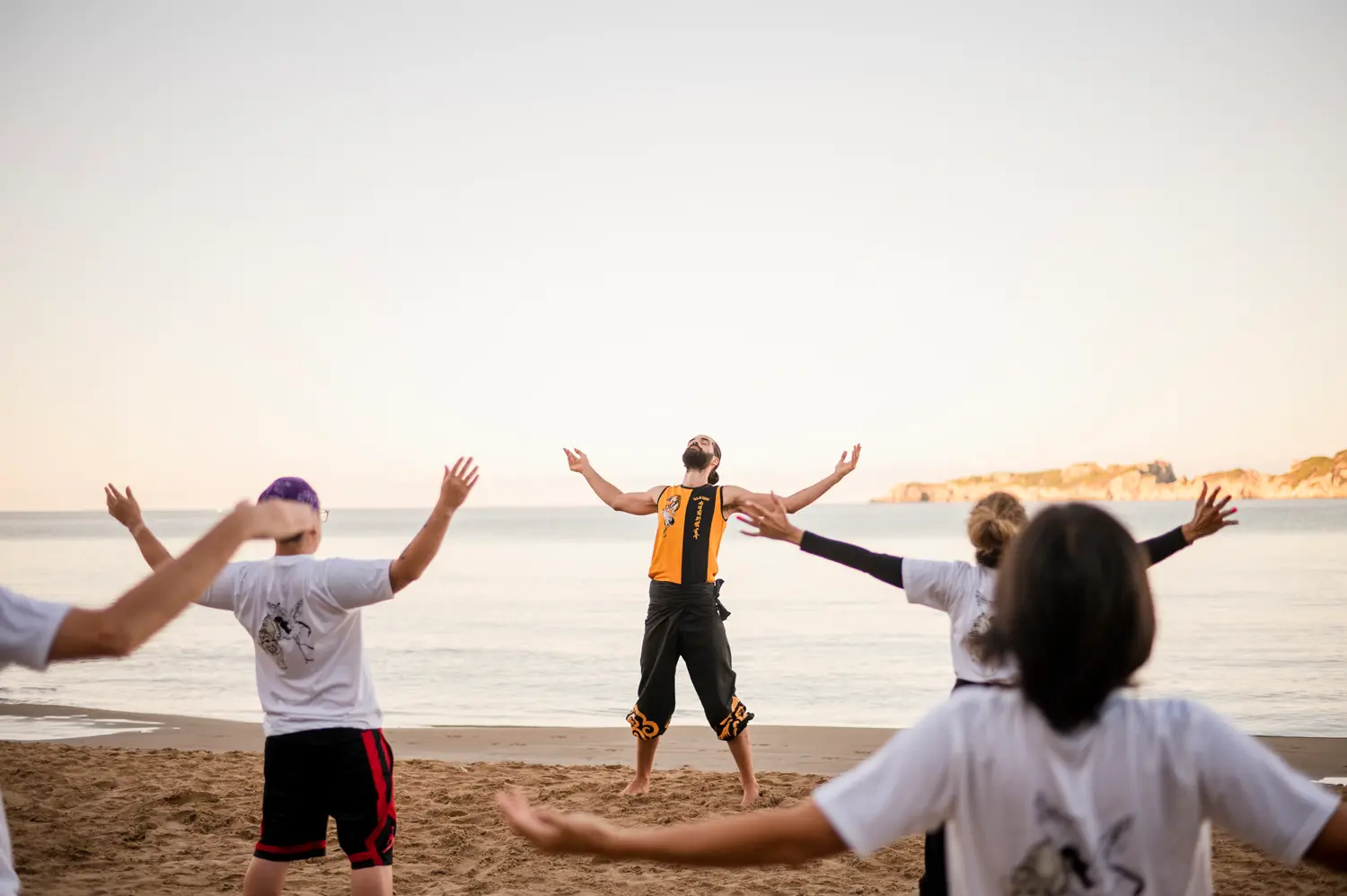 Students training in traditional Shaolin Kung Fu on the beach in Corfu