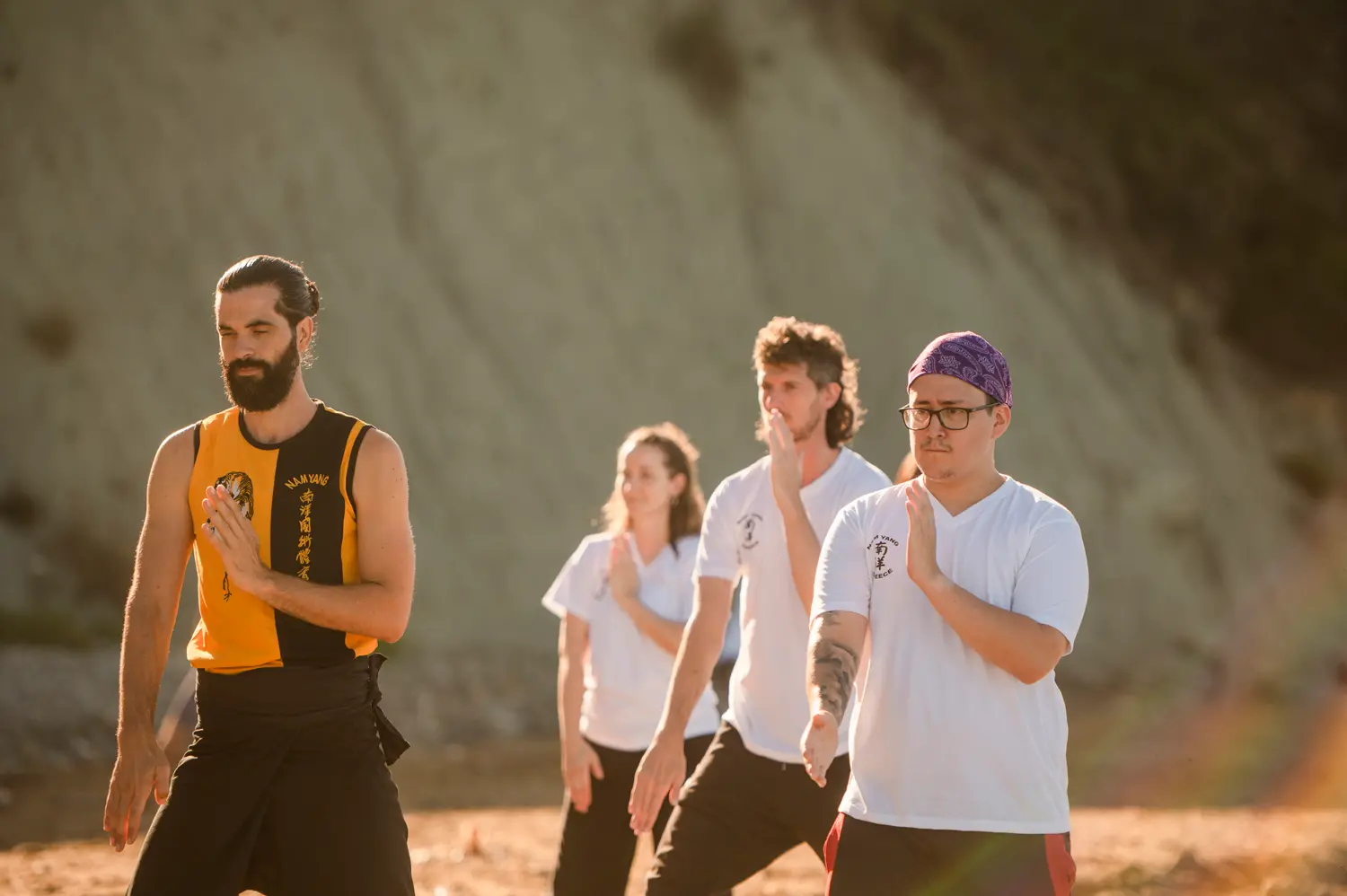 Thomas leading students through golden-hour beach training in Corfu