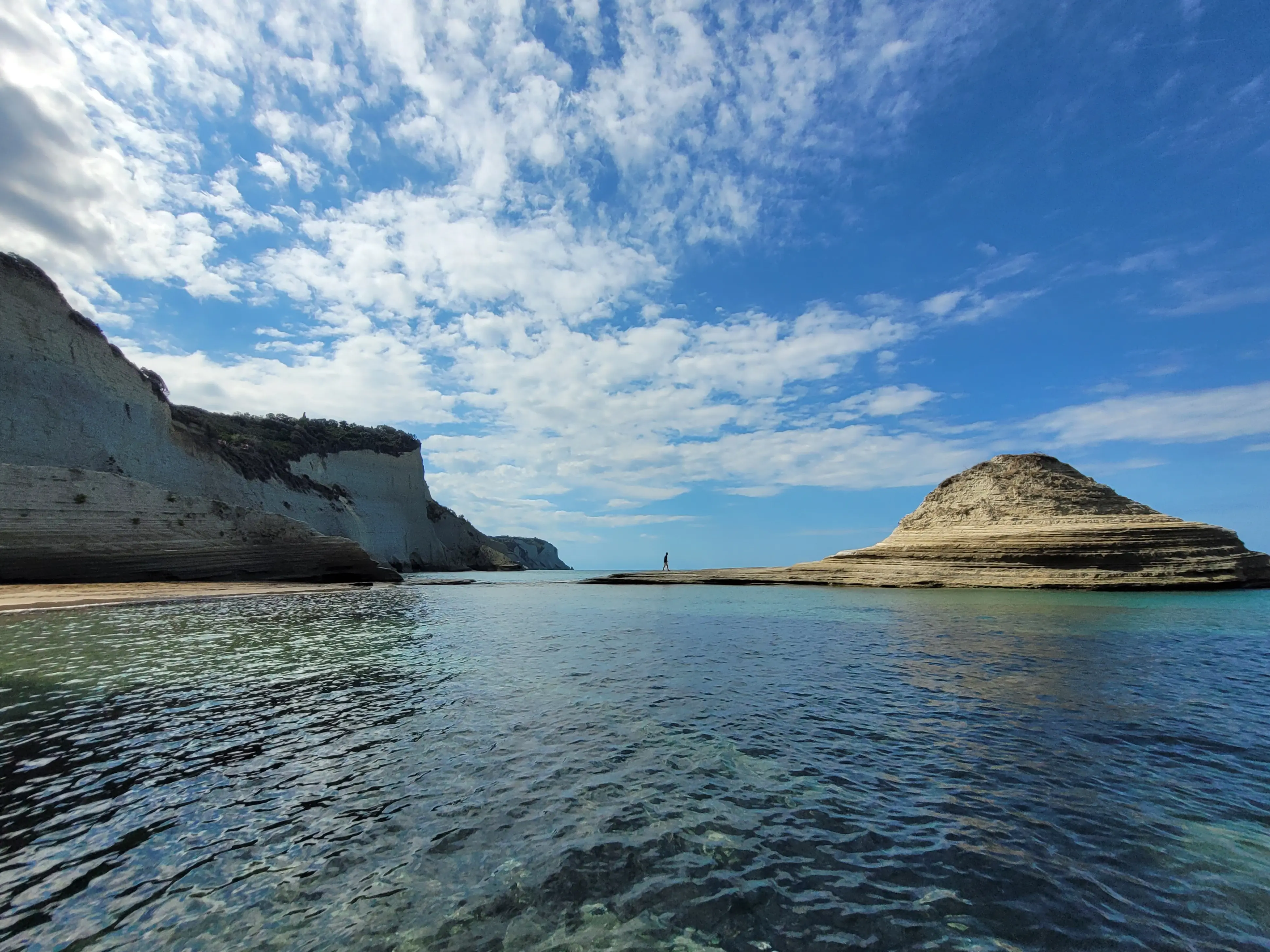 Hidden cove in Corfu — crystal clear water and quiet coastline