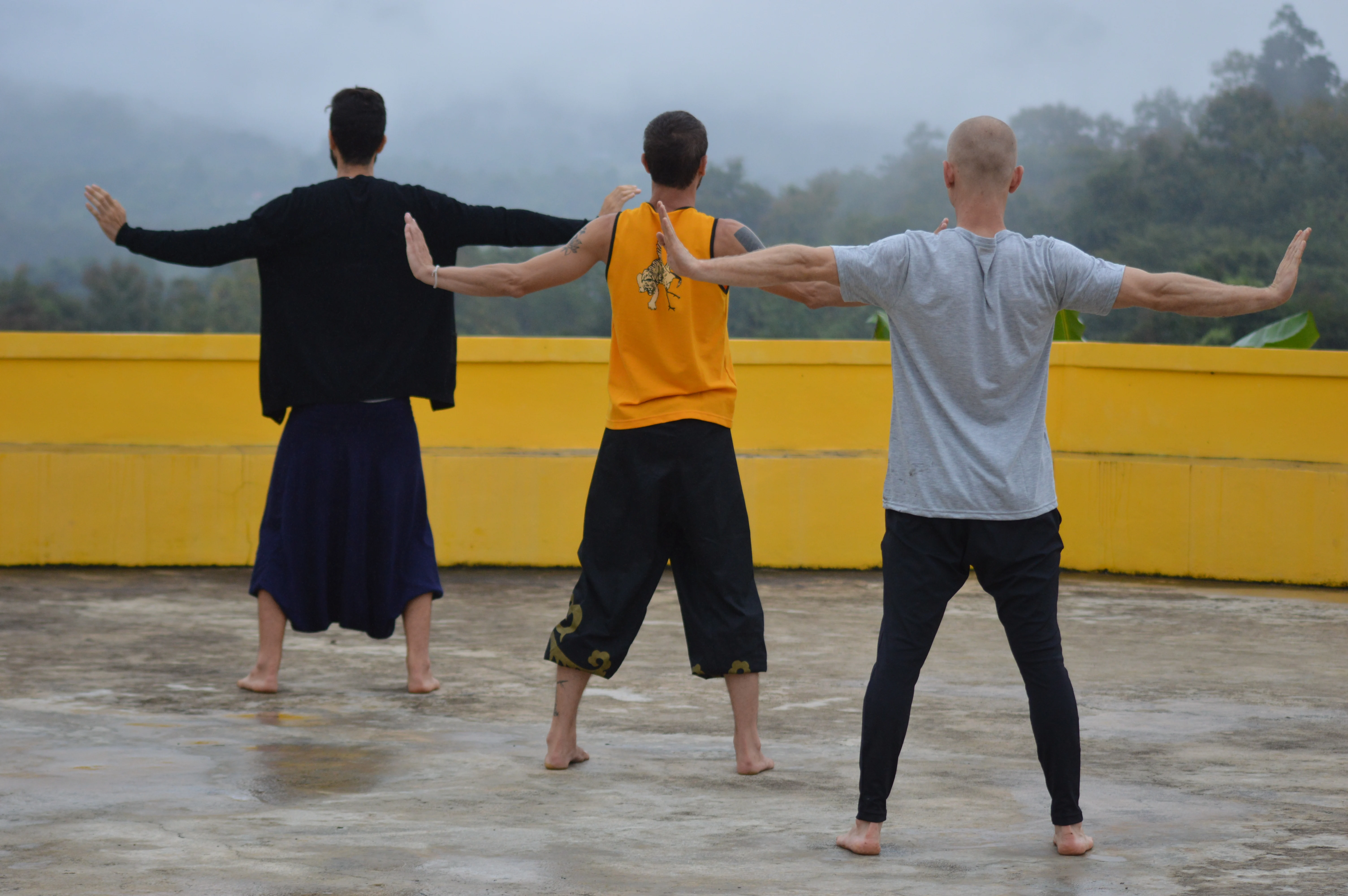 Thomas training with fellow students during morning practice on a rooftop at the Nam Yang Kung Fu Retreat