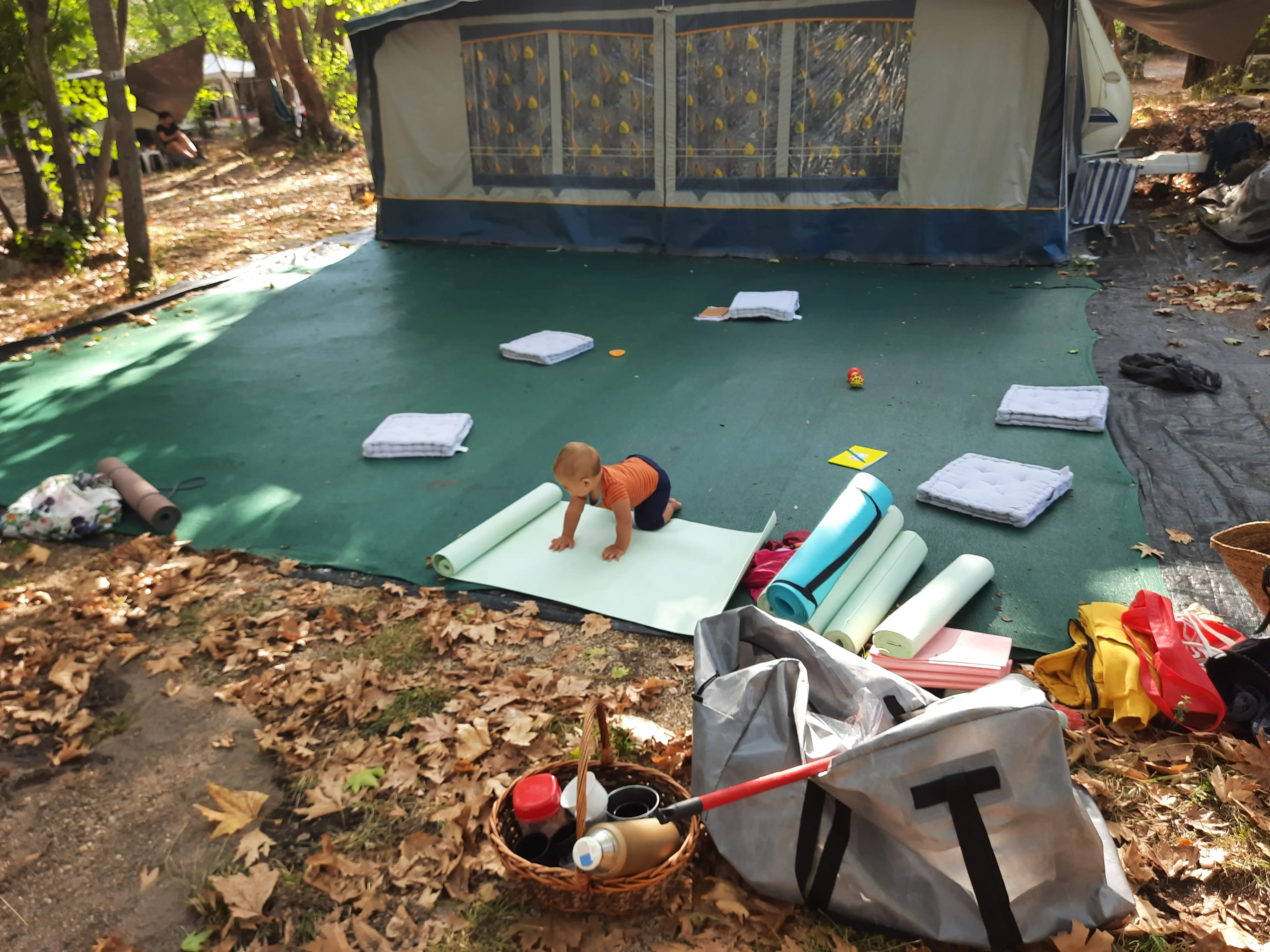Thomas's son crawling across the retreat training mats during an early Corfu retreat