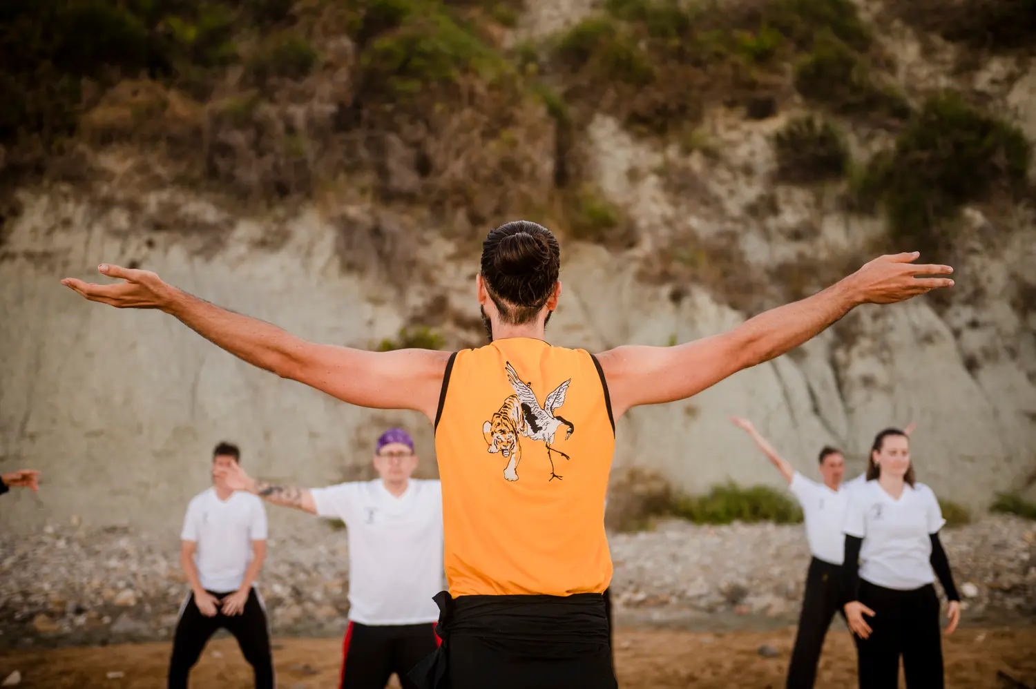 Thomas teaching the opening posture of Tong Ling Chi Kung during a training session in Corfu, students following the movement