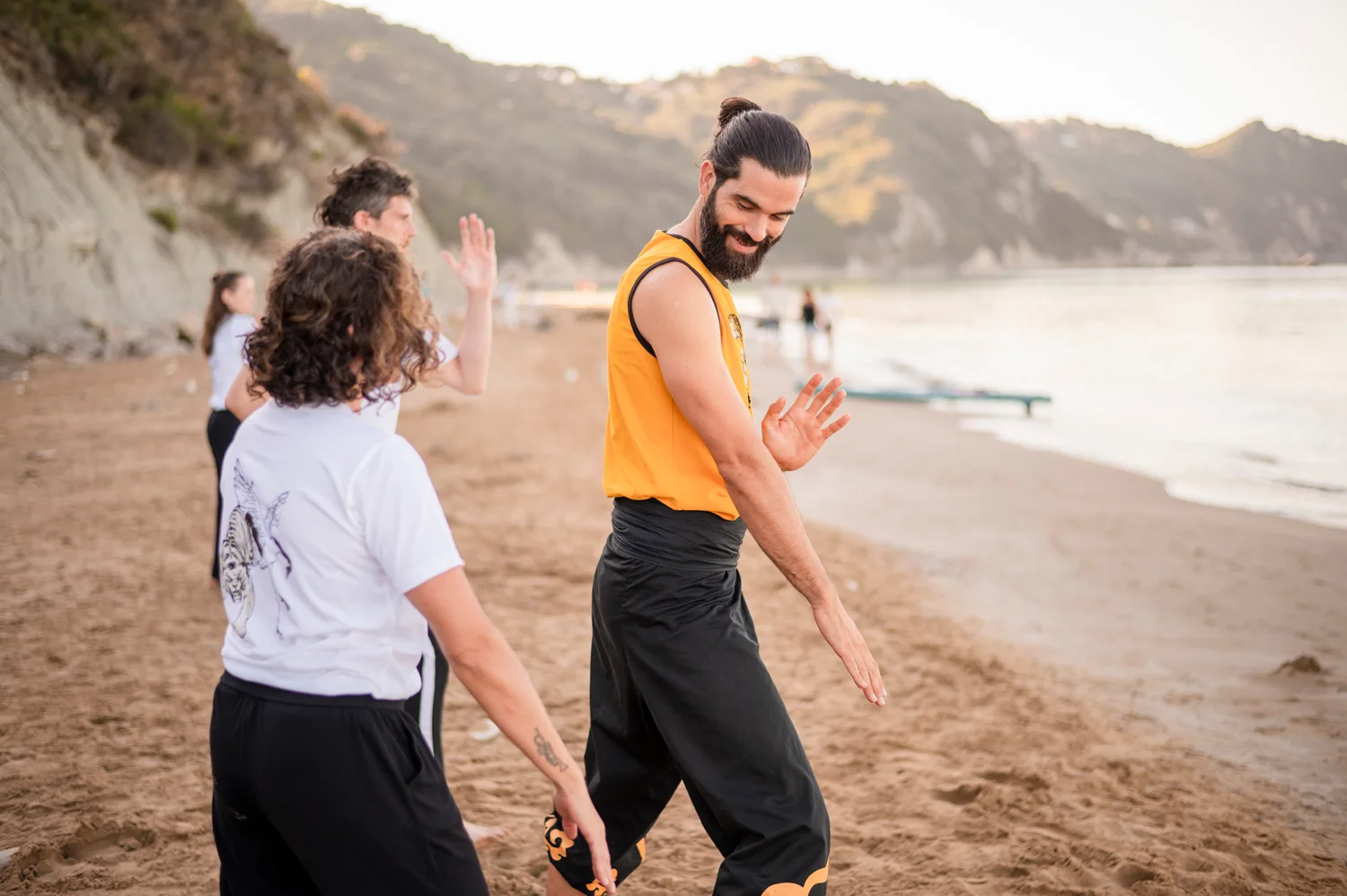 Thomas practising Shuang Yang with a student on Arillas beach